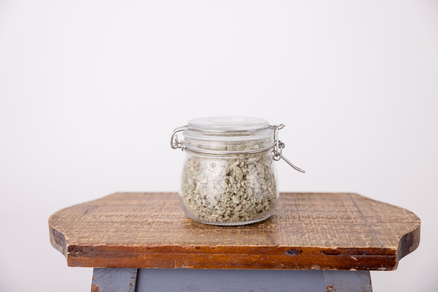 Jar of dried mugwort used in herbal practice