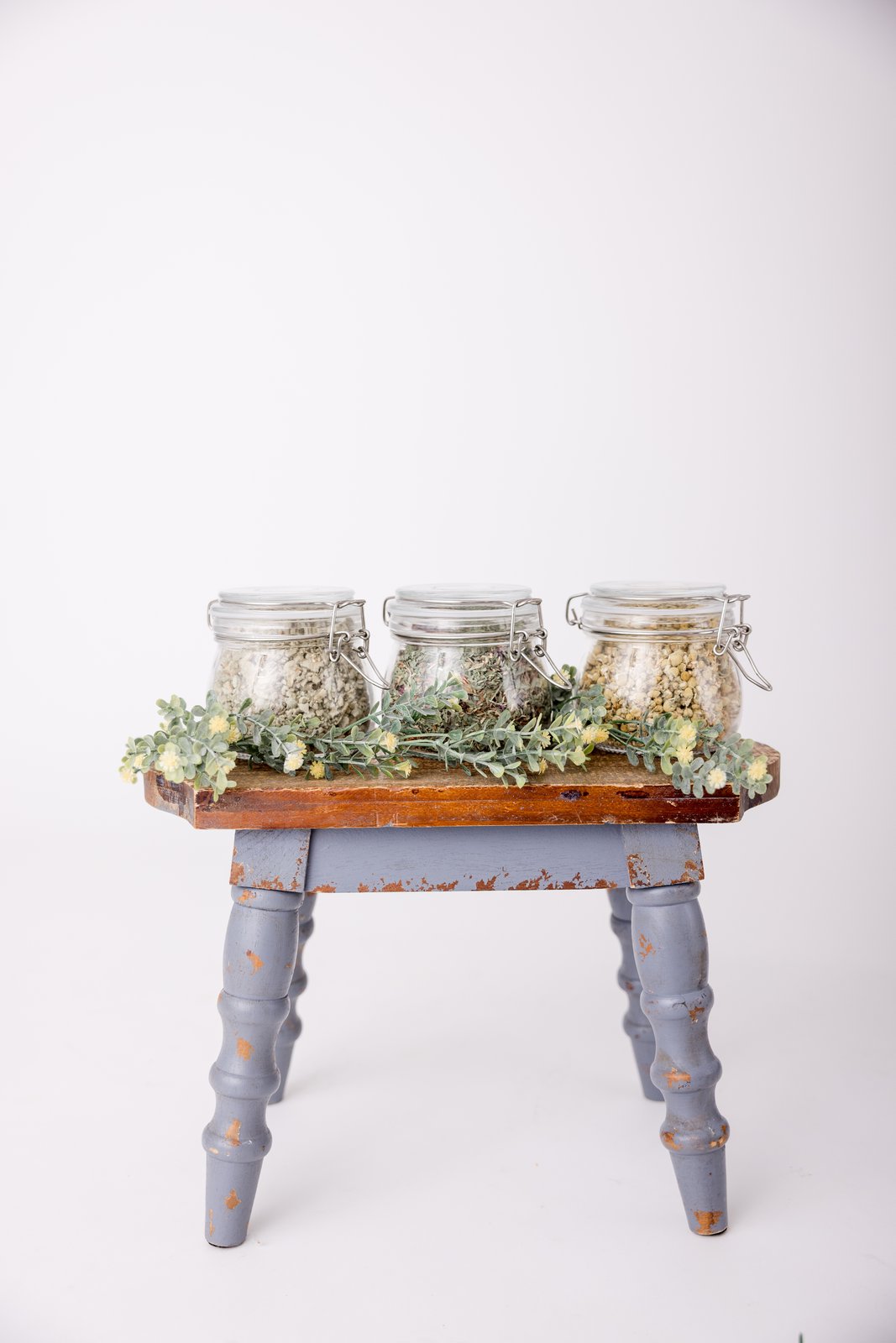 Jars of dried herbs used in Christina's holistic practice